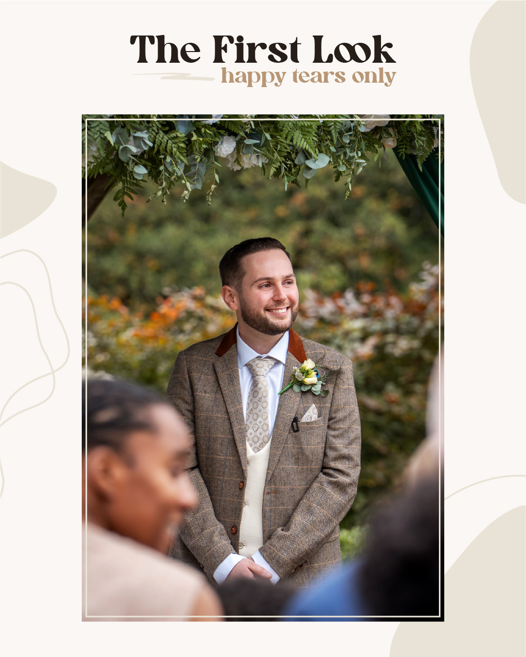 A groom in a brown checked suit and boutonniere smiles while standing outdoors under greenery, with guests in the foreground. Text above reads, "The First Look, happy tears only. Wedding Photo taken by Jennings Photography